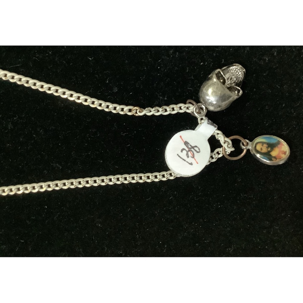 Skull and portrait of Jesus necklace .